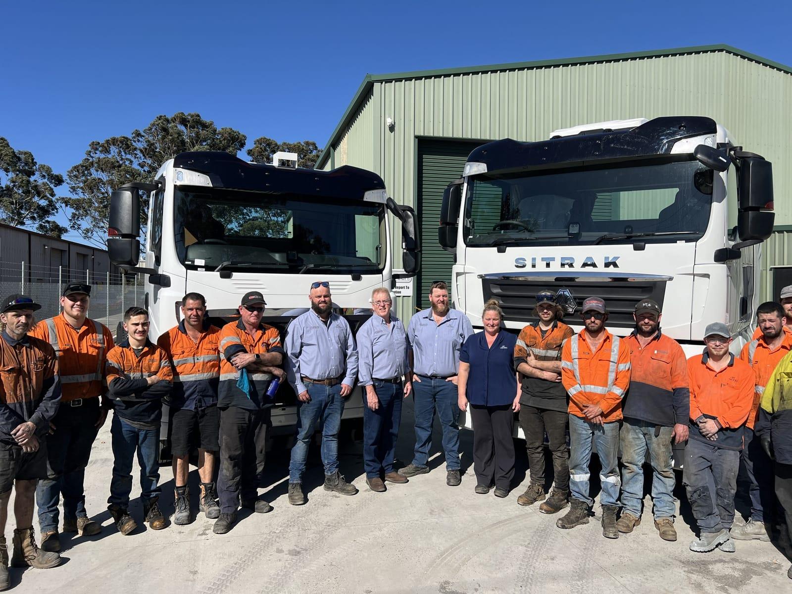 Team in front of the workshop